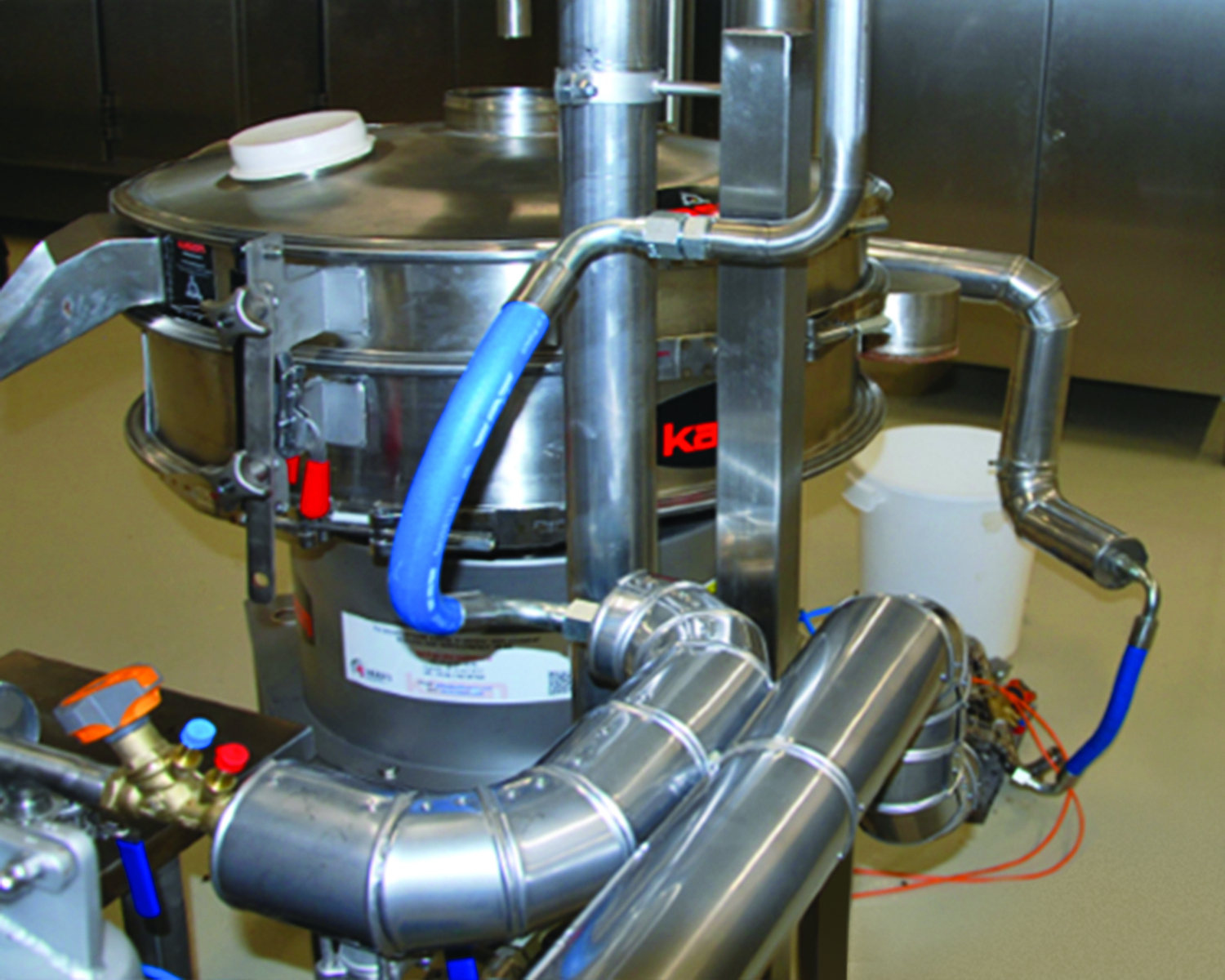 Solid food ingredients are separated form 44-50&deg;C (113-122&deg;F) molten chocolate fed to the screener through double-wall piping.